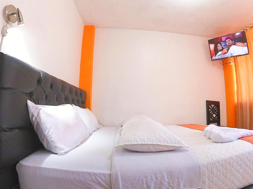 Postel nebo postele na pokoji v ubytování Hostal Anais