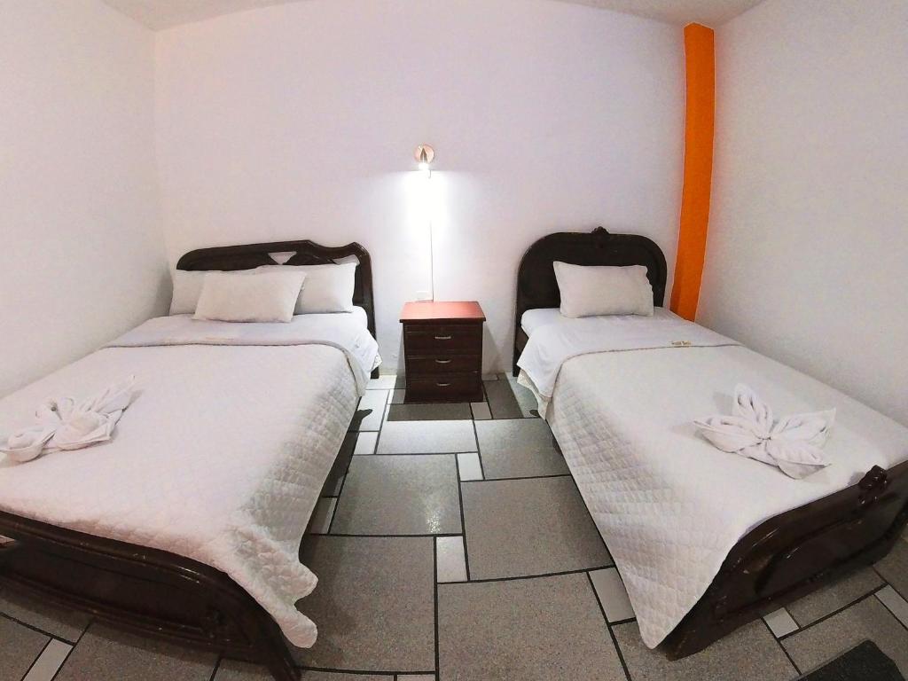 Postel nebo postele na pokoji v ubytování Hostal Anais