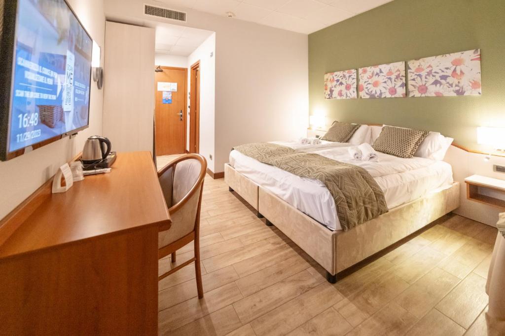 Łóżko lub łóżka w pokoju w obiekcie Hotel all'Orso