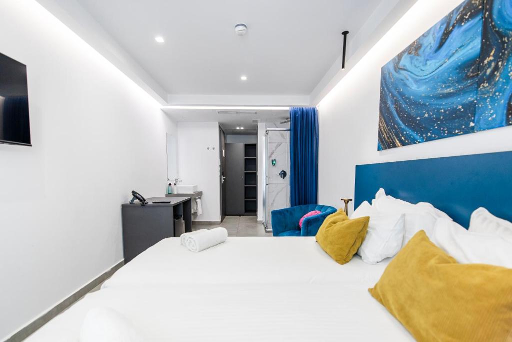 Postel nebo postele na pokoji v ubytování Flamingo Hotel Malta
