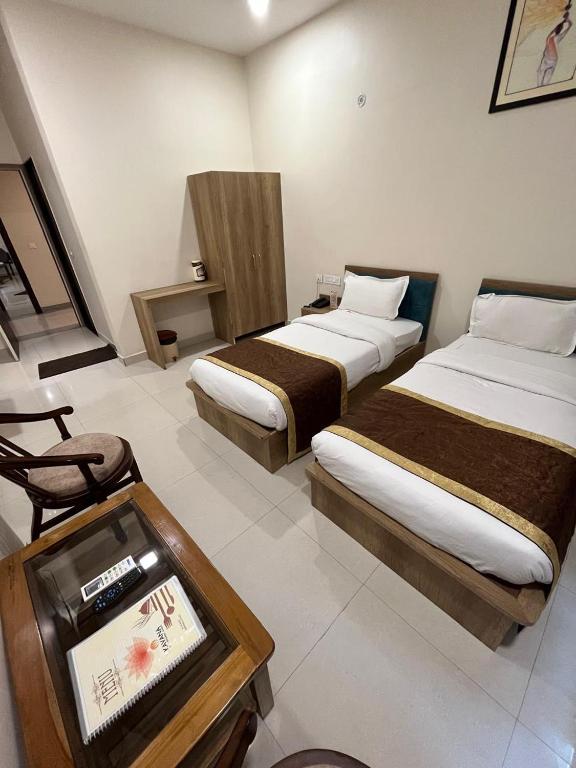 Postel nebo postele na pokoji v ubytování HOTEL KAVANA
