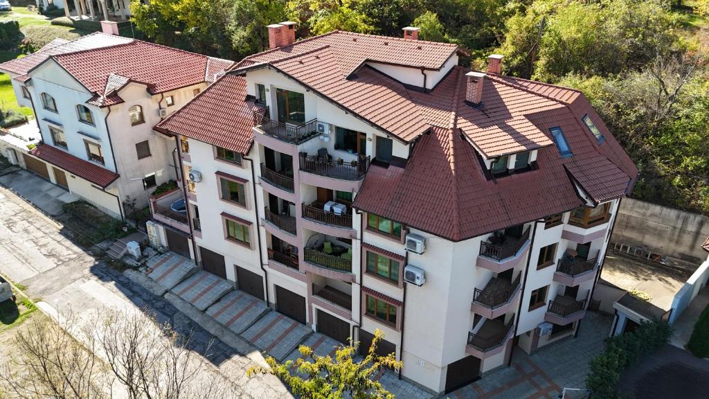 an overhead view of a building with a red roof at PANORAMA APARTMENT in Montana