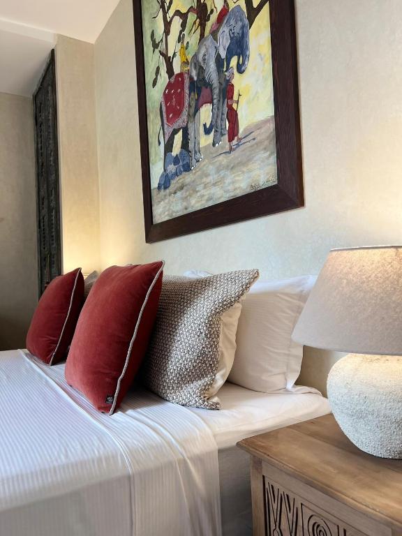 Postel nebo postele na pokoji v ubytování Riad dar Tayri