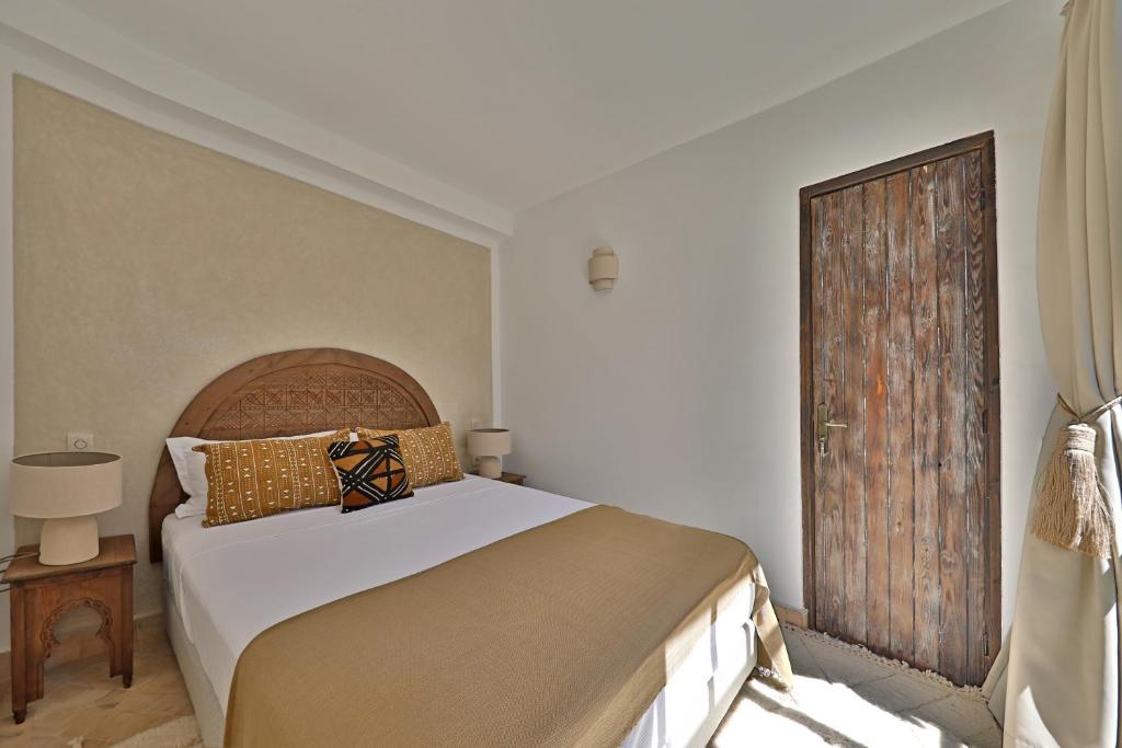Postel nebo postele na pokoji v ubytování Riad dar Tayri