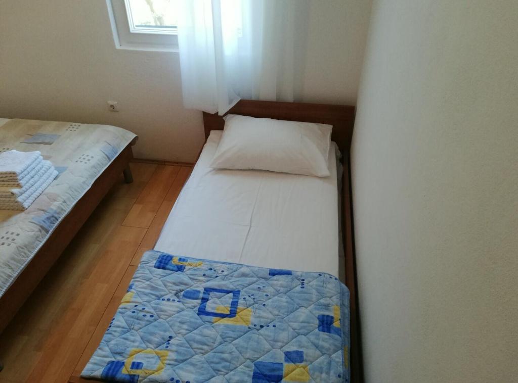 Posteľ alebo postele v izbe v ubytovaní Apartments Marijan