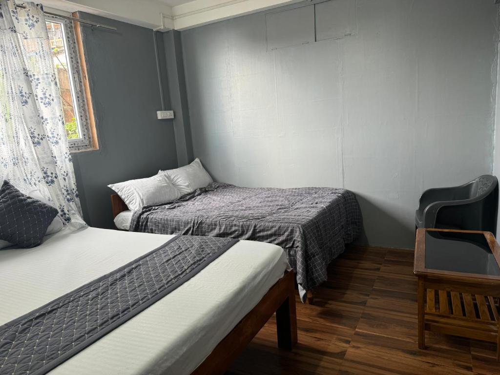 Postel nebo postele na pokoji v ubytování Aama Home Stay