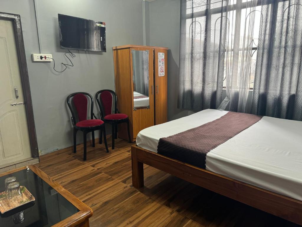 Postel nebo postele na pokoji v ubytování Aama Home Stay