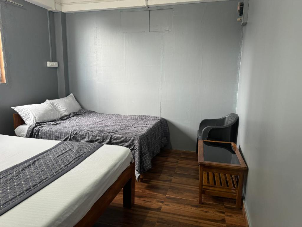Postel nebo postele na pokoji v ubytování Aama Home Stay