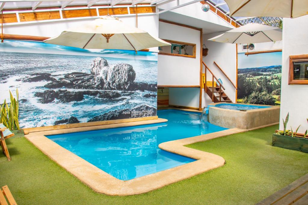 Bazén v ubytování Rustika Pichilemu Apart Hotel Piscina Temperada Hidromasaje nebo v jeho okolí