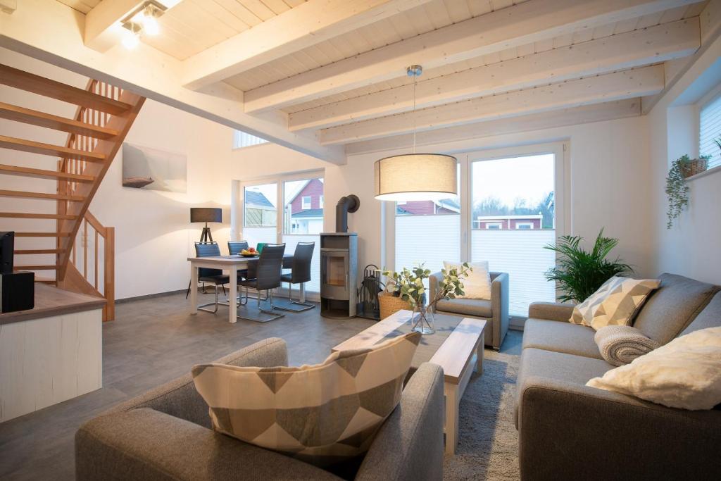 a living room with a couch and a table at VechteSonne - Nordhorn in Nordhorn