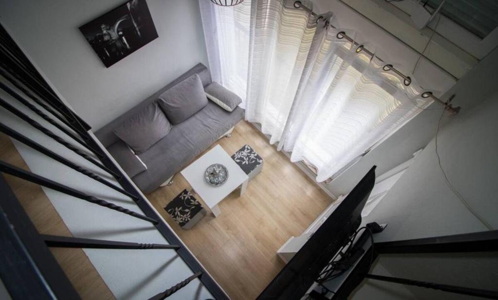 an overhead view of a living room with a couch at Kaldrma Guesthouse in Mostar
