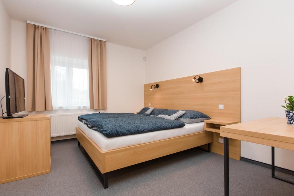 Postel nebo postele na pokoji v ubytování Vila Vivenot