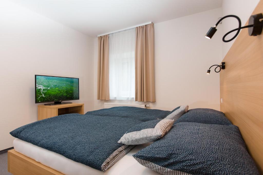 Postel nebo postele na pokoji v ubytování Vila Vivenot