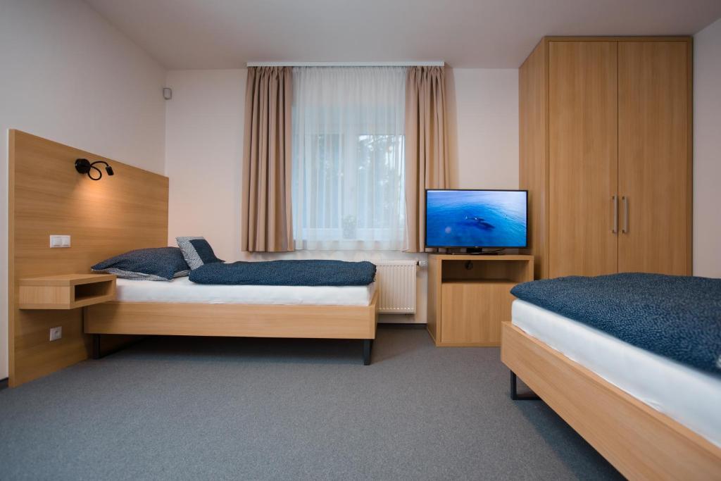 Postel nebo postele na pokoji v ubytování Vila Vivenot