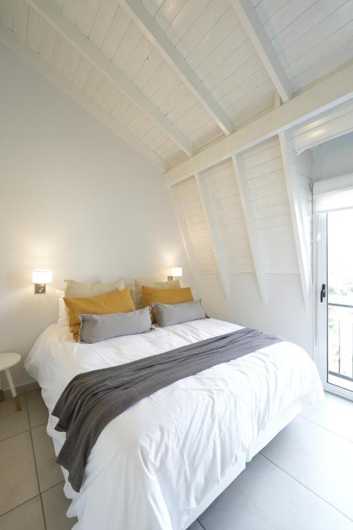 Postel nebo postele na pokoji v ubytování Be mas apartamentos boutique Villa Gral Belgrano