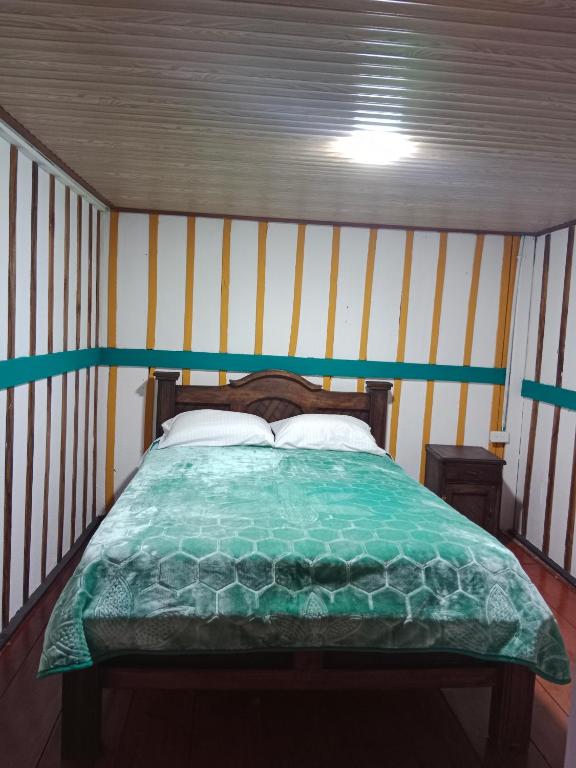 Postel nebo postele na pokoji v ubytování Hostal Casa Celeste