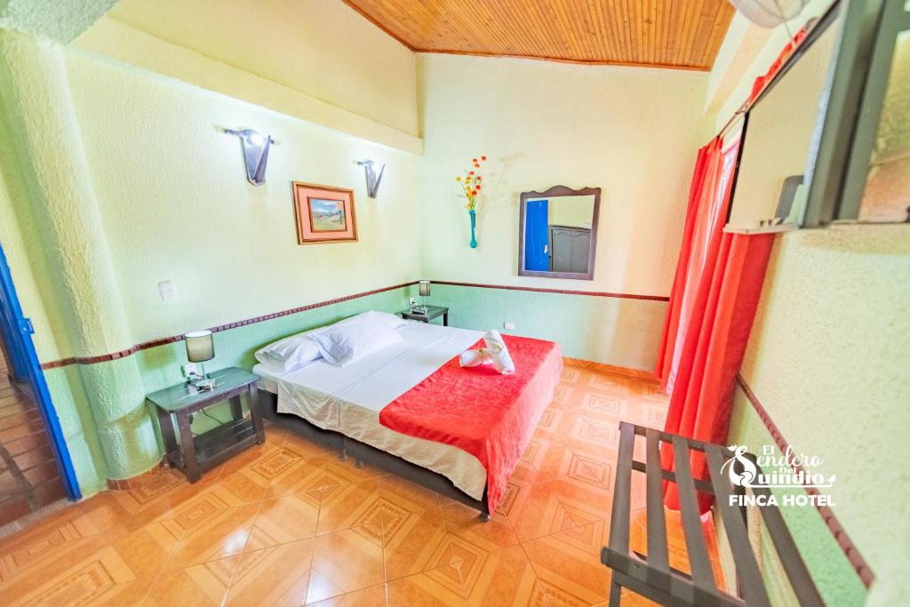 Postel nebo postele na pokoji v ubytování El Sendero del Quindío I Finca Hotel I Eje Cafetero