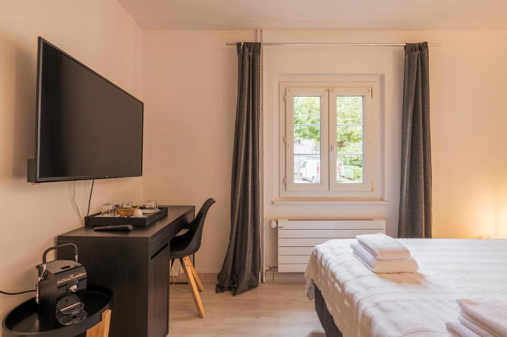 TV a/nebo společenská místnost v ubytování Amanthos Living Nyon