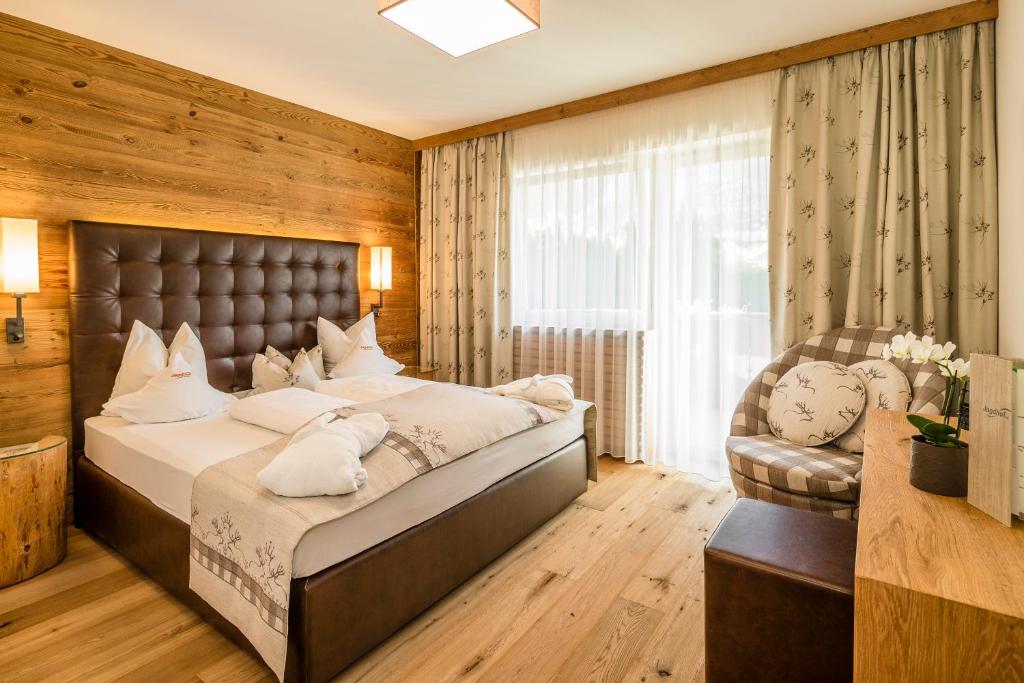 Łóżko lub łóżka w pokoju w obiekcie DolceVita Hotel Jagdhof