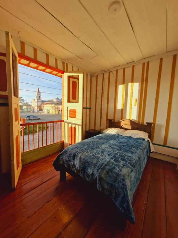 Postel nebo postele na pokoji v ubytování Hostal Casa Celeste
