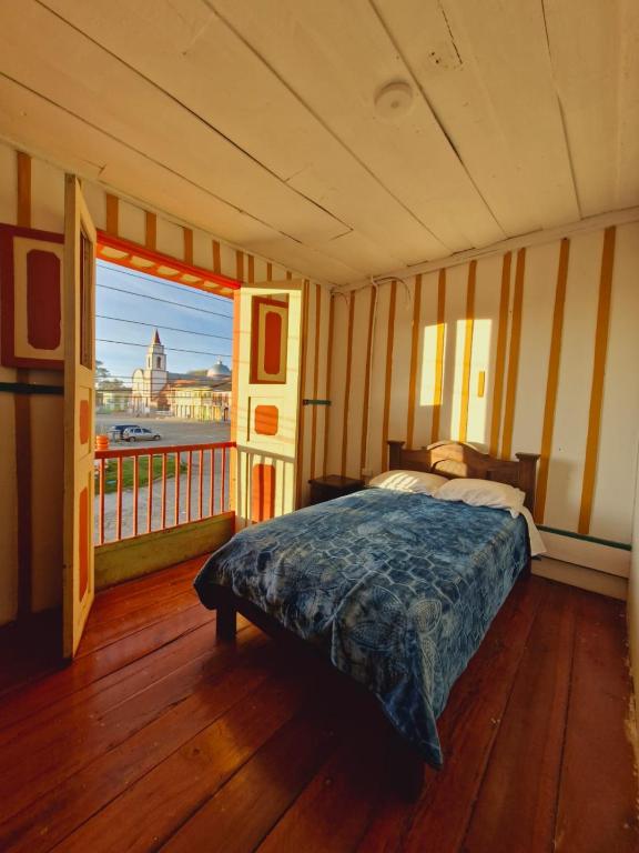 Postel nebo postele na pokoji v ubytování Hostal Casa Celeste