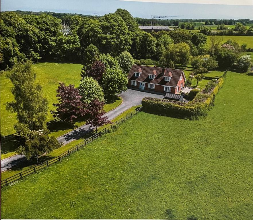 an aerial view of a house in a field at No 1 Willow Lodge in Skephubble