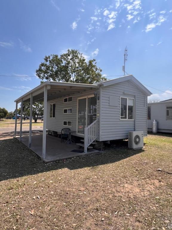 a mobile home with a porch and a deck at Pioneer Caravan Park in Dalby