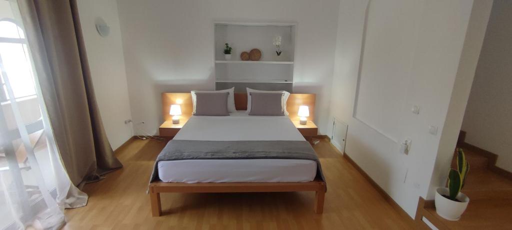 Postel nebo postele na pokoji v ubytování Casa TIANA