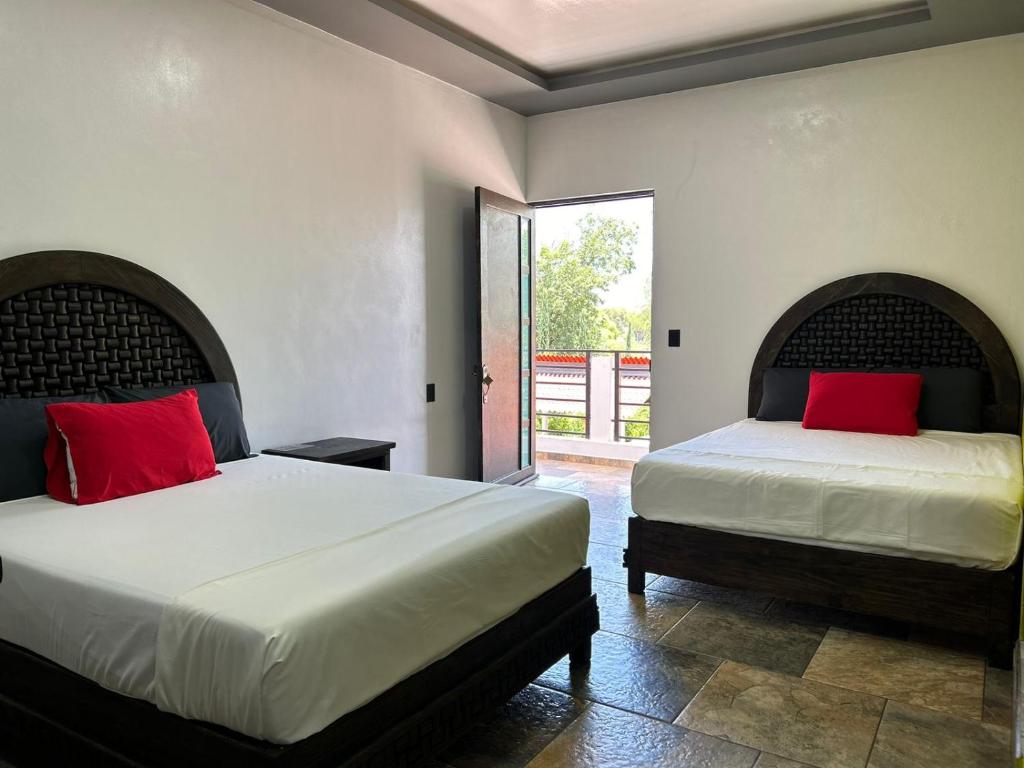 Postel nebo postele na pokoji v ubytování Hotel Villas Camargo