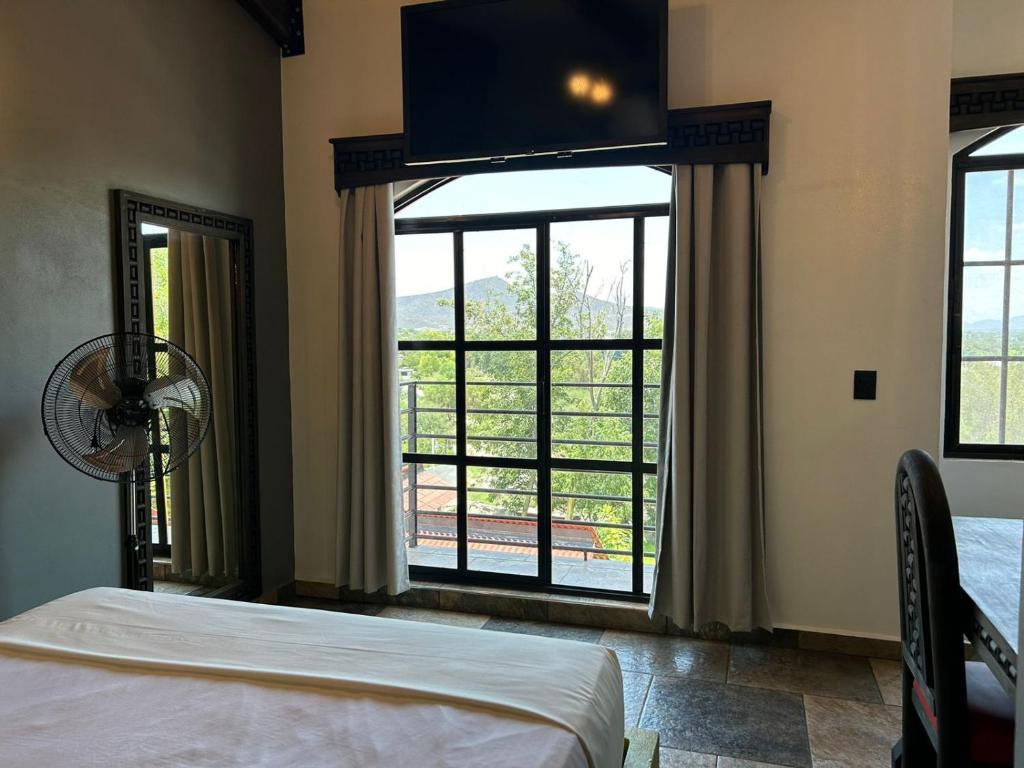 Postel nebo postele na pokoji v ubytování Hotel Villas Camargo