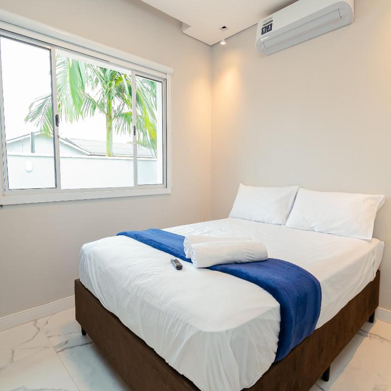 Postel nebo postele na pokoji v ubytování M&M House - Casa com Piscina e Ar Condicionado em Matinhos