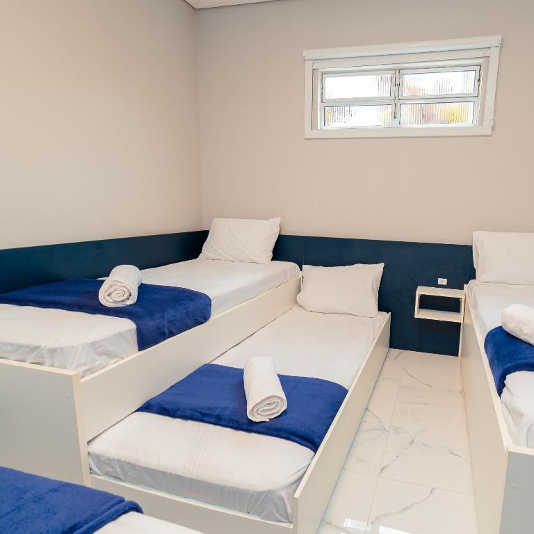 Postel nebo postele na pokoji v ubytování M&M House - Casa com Piscina e Ar Condicionado em Matinhos