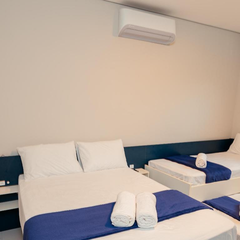 Postel nebo postele na pokoji v ubytování M&M House - Casa com Piscina e Ar Condicionado em Matinhos
