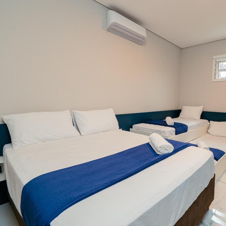 Postel nebo postele na pokoji v ubytování M&M House - Casa com Piscina e Ar Condicionado em Matinhos