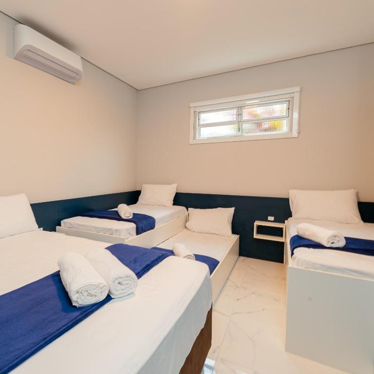 Postel nebo postele na pokoji v ubytování M&M House - Casa com Piscina e Ar Condicionado em Matinhos
