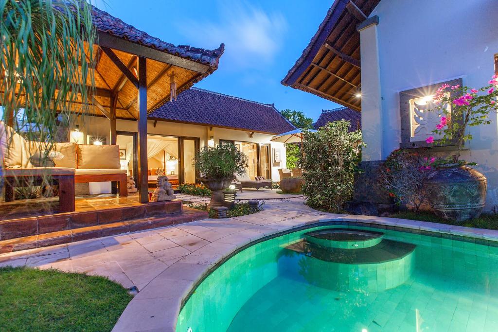 a swimming pool in the backyard of a house at Private 3BR Villa with Pool - Quiet & Spacious - Near Seminyak & Legian Beach in Seminyak