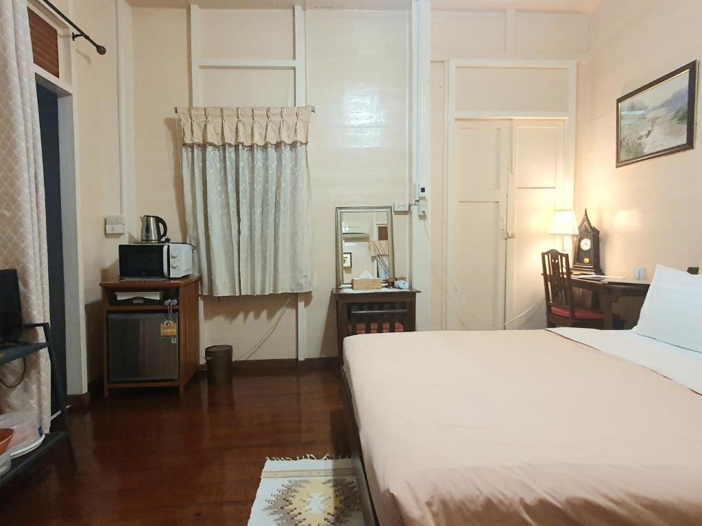 Postel nebo postele na pokoji v ubytování KINN Stay50 Bangkok