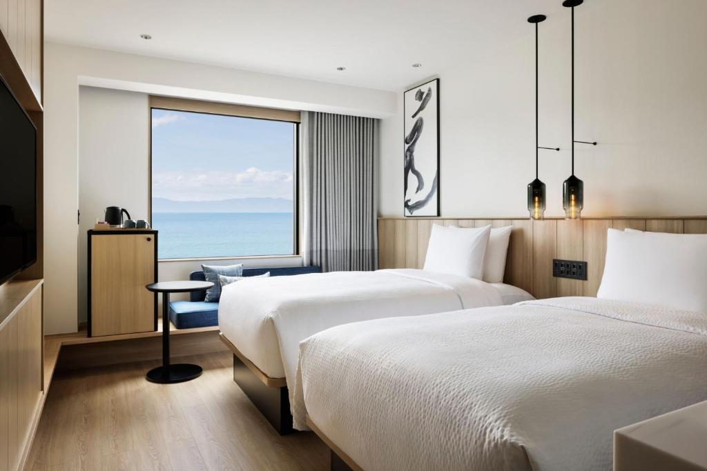 Fairfield by Marriott Kagoshima Sakurajimaにあるベッド