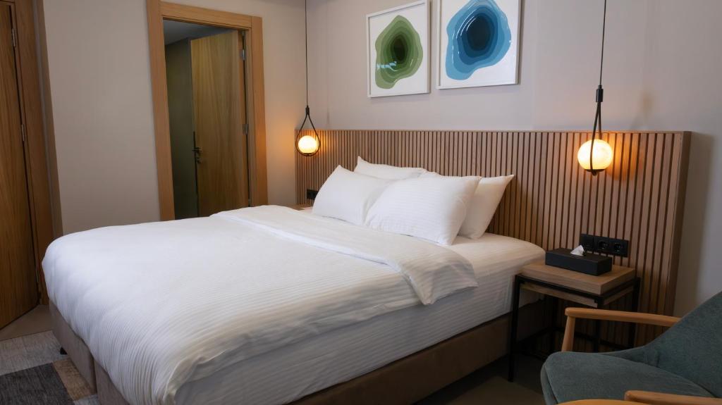 Postel nebo postele na pokoji v ubytování BeL LETTO HOTEL