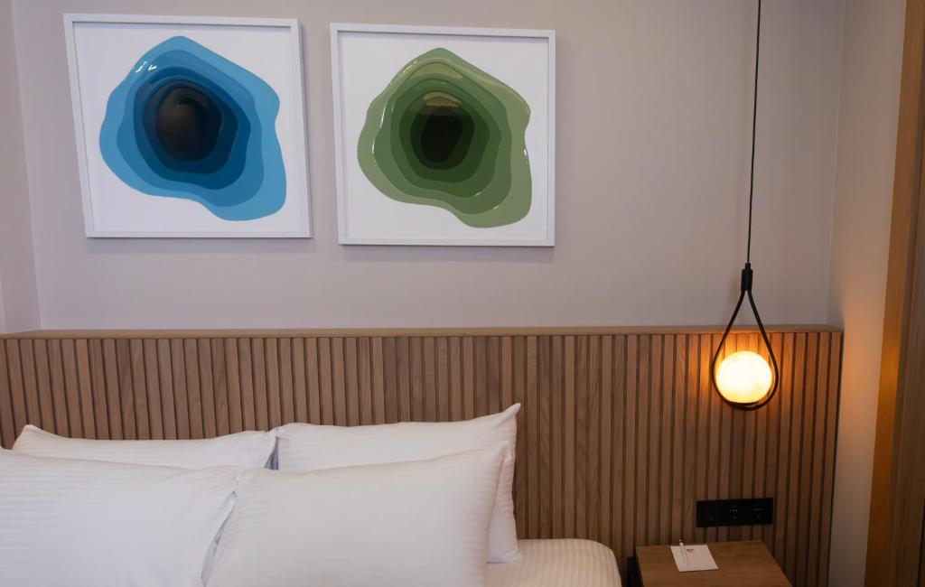 Postel nebo postele na pokoji v ubytování BeL LETTO HOTEL