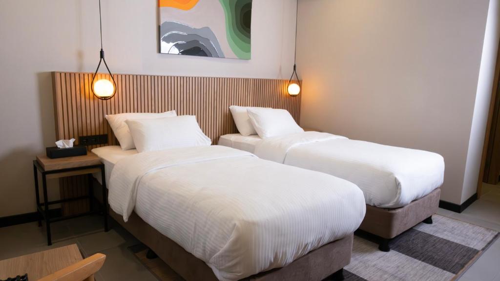 Postel nebo postele na pokoji v ubytování BeL LETTO HOTEL