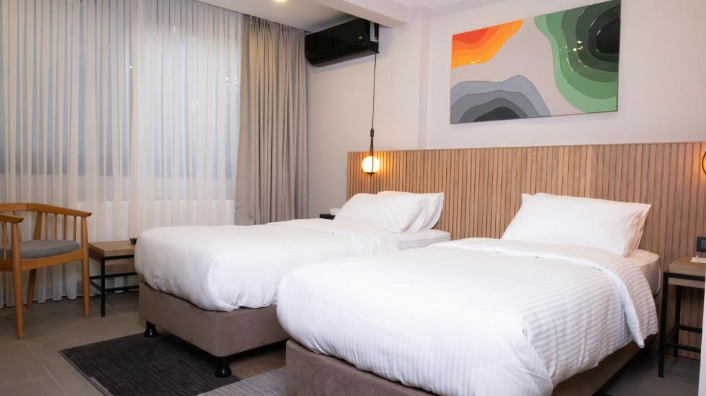 Postel nebo postele na pokoji v ubytování BeL LETTO HOTEL