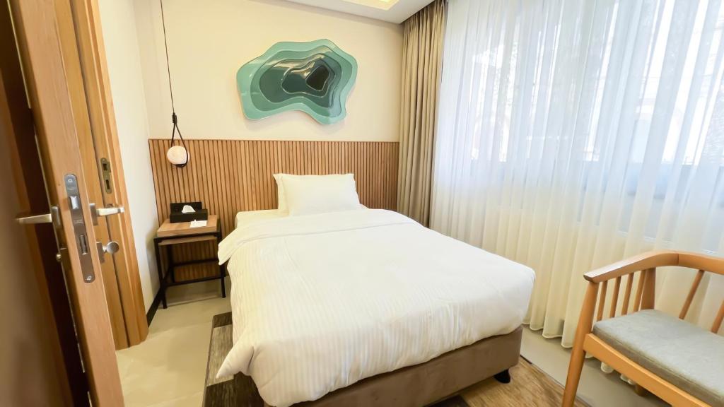 Postel nebo postele na pokoji v ubytování BeL LETTO HOTEL