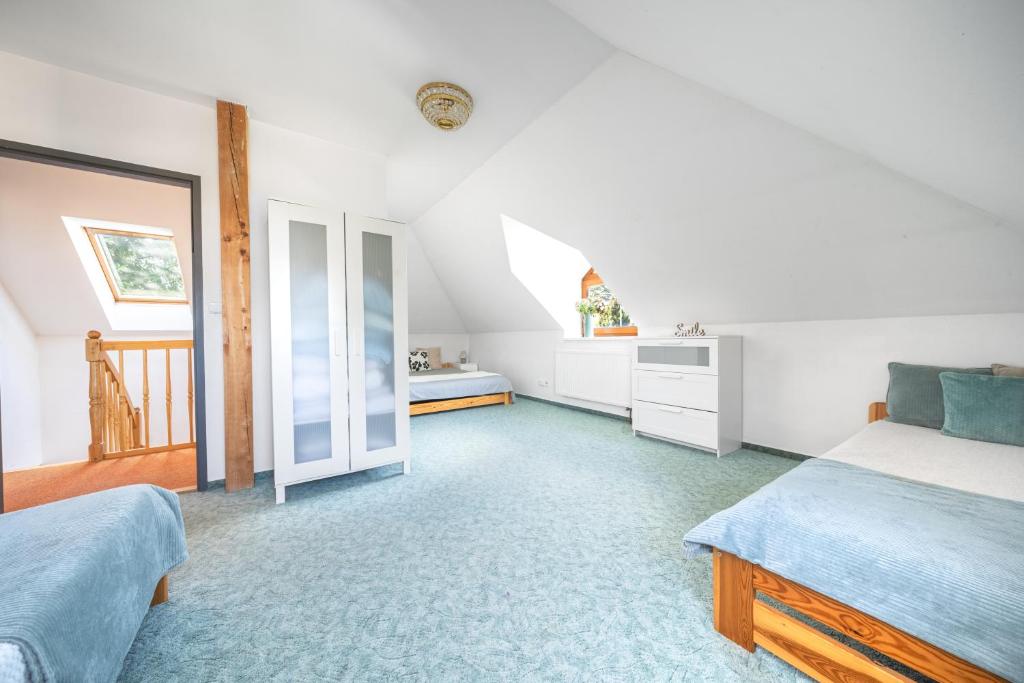Postel nebo postele na pokoji v ubytování Holiday Home Smržovka