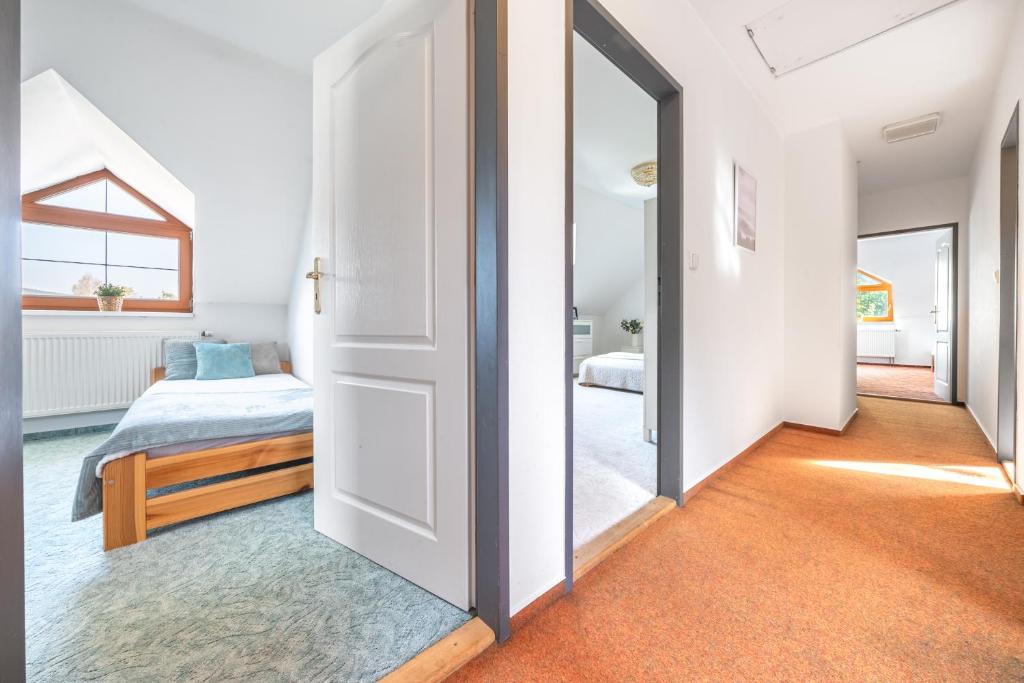 Postel nebo postele na pokoji v ubytování Holiday Home Smržovka