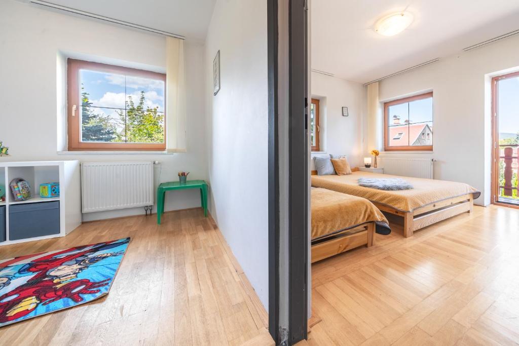 Postel nebo postele na pokoji v ubytování Holiday Home Smržovka