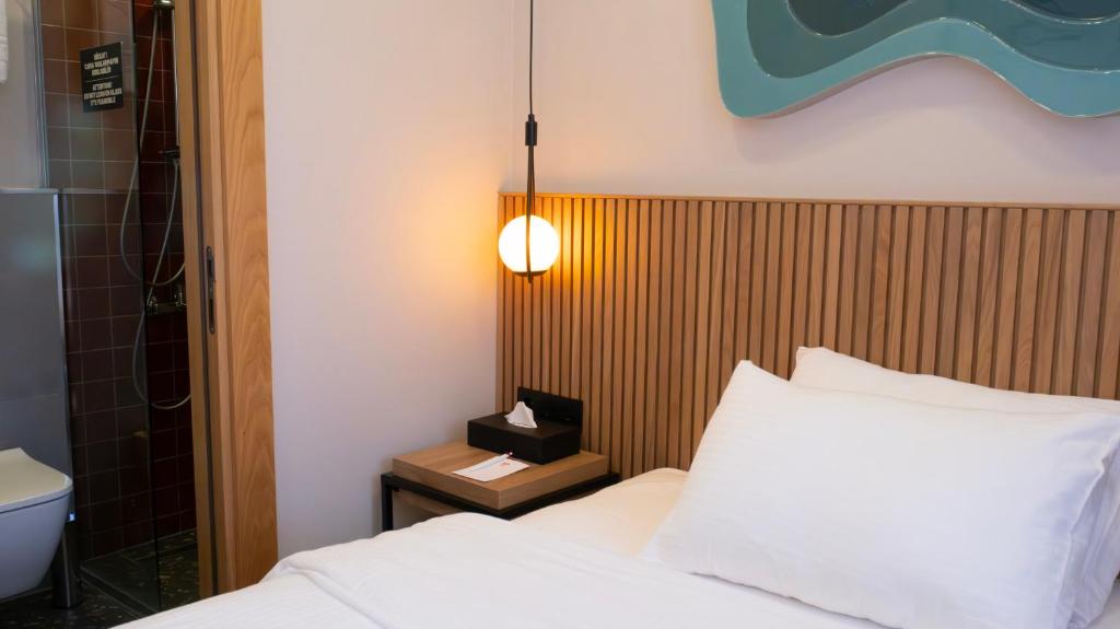 Postel nebo postele na pokoji v ubytování BeL LETTO HOTEL