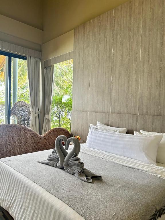 Postel nebo postele na pokoji v ubytování Kai Bae Beach Resort Koh Chang