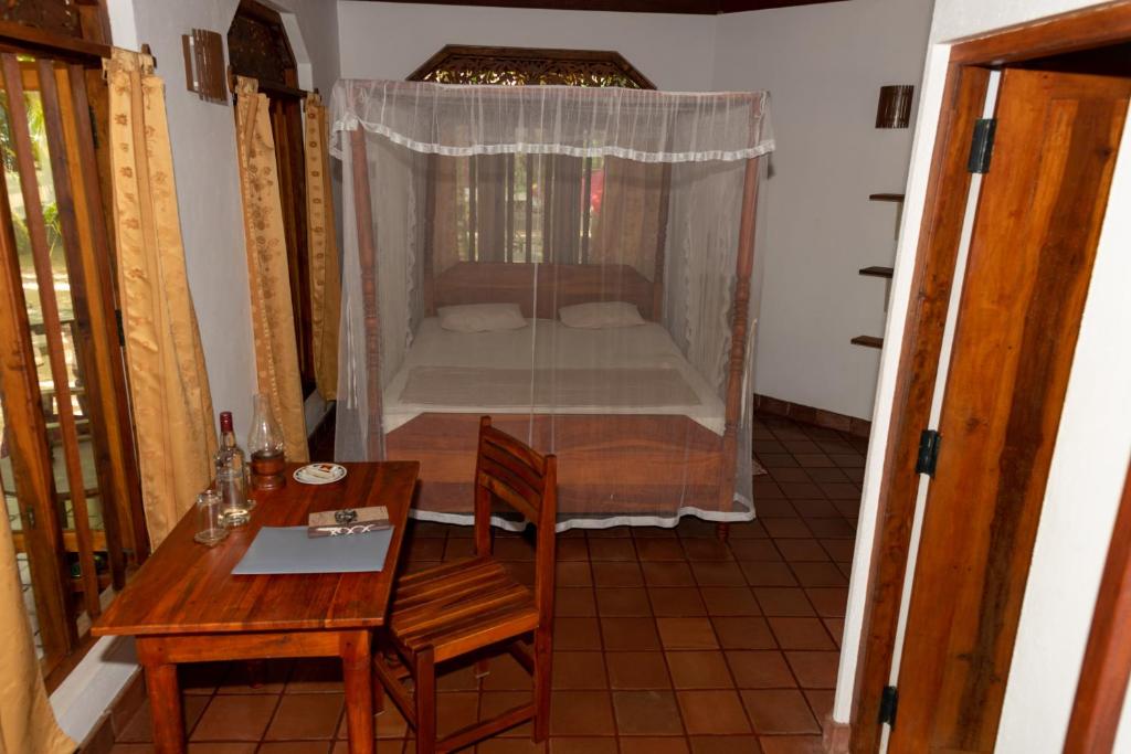 Postel nebo postele na pokoji v ubytování Patini Bungalows - Beach Garden