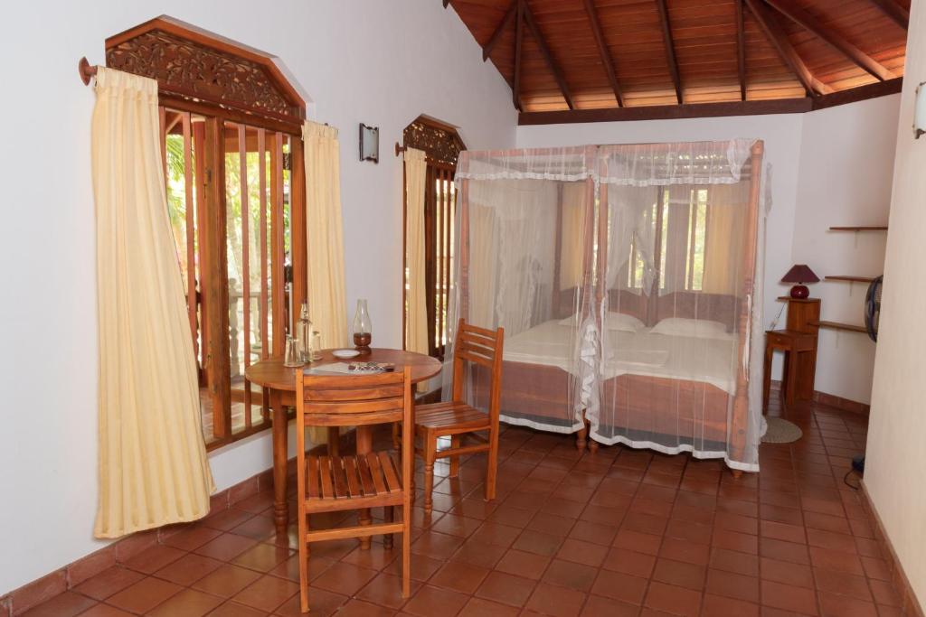 Postel nebo postele na pokoji v ubytování Patini Bungalows - Beach Garden